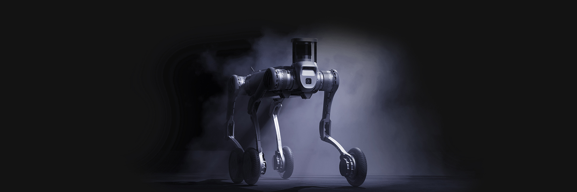 Unitree B2-W, robot kroczący, stojący na szarym tle